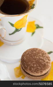 chocolate macaroon cake with cup of coffee