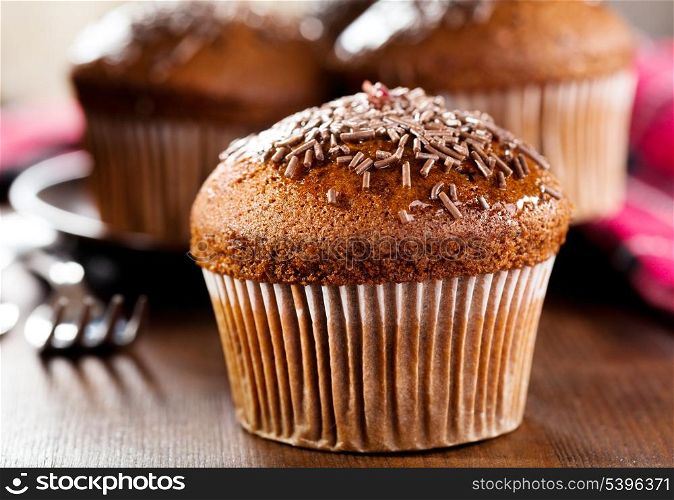 chocolate muffin on wooden table