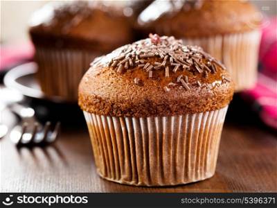 chocolate muffin on wooden table