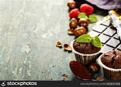 Chocolate muffins on wooden board - food and drink