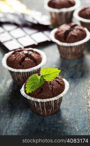 Chocolate muffins on wooden board - food and drink