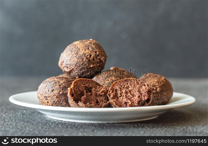 Chocolate pancake puppies on the white plate