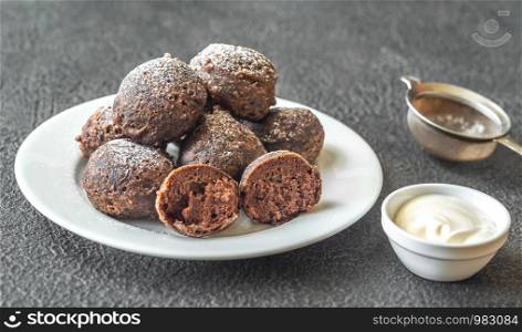 Chocolate pancake puppies served with cream cheese