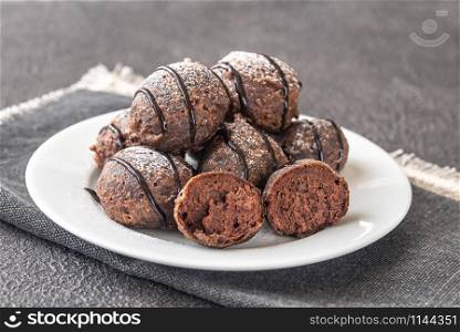 Chocolate pancake puppies served with dessert topping