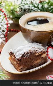 Chocolate pie and cup of coffee with festive decorations, selective focus