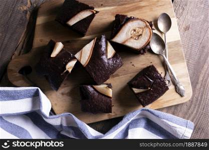 chocolate pie with pears. coffee pot and cup. still life and autumn background