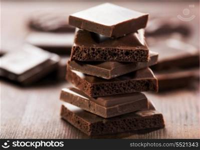 Chocolate pieces on wooden table