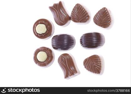 chocolate pralines on white background. Delicious dark and milk chocolate pralines.