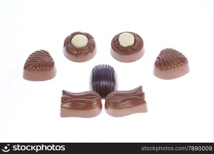 chocolate pralines on white background. Delicious dark and milk chocolate pralines.