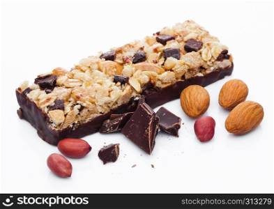 Chocolate protein cereal energy bar with almonds and peanuts white background