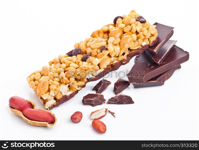 Chocolate protein cereal energy bar with peanuts on white background