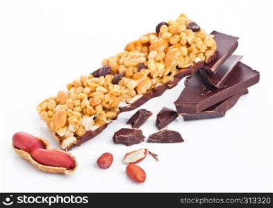 Chocolate protein cereal energy bar with peanuts on white background