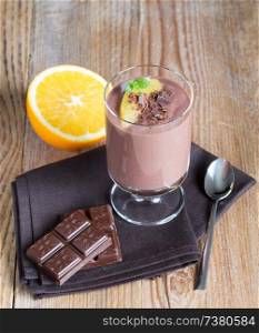 Chocolate pudding dessert with orange and grated chocolate.. Chocolate pudding dessert with orange and grated chocolate