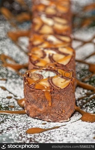 Chocolate roll with various caramel and cream