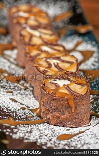 Chocolate roll with various caramel and cream