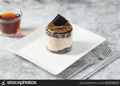 Chocolate single mini cake on a white porcelain plate