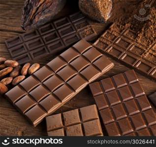 Chocolate sweet, cocoa pod and food dessert background. Cocoa pod and chocolate bar and food dessert background