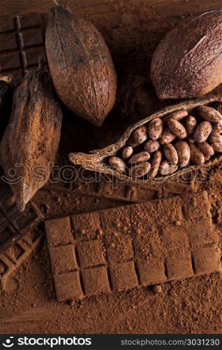 Chocolate sweet, cocoa pod and food dessert background. Cocoa pod and chocolate bar and food dessert background