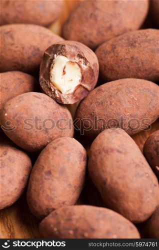 Chocolate truffles with nuts, close up as a background