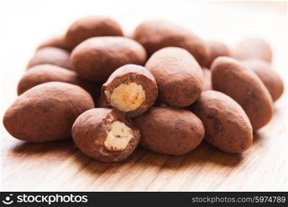 Chocolate truffles with nuts, close up as a background