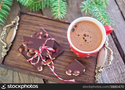 chocolate with hazelnuts and hot cocoa in cup