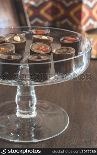 Chocolates in a luxurious glass dish. Various sweets