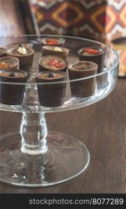 Chocolates in a luxurious glass dish. Various sweets