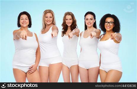 choice, friendship, beauty, body positive and people concept - group of happy different women in white underwear pointing finger on you over blue background
