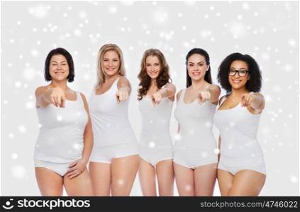 choice, friendship, beauty, body positive and people concept - group of happy different women in white underwear pointing finger on you over snow