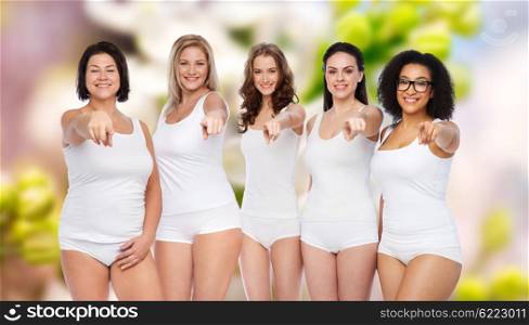 choice, friendship, beauty, body positive and people concept - group of happy different women in white underwear pointing finger on you over natural spring background