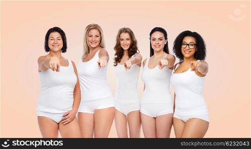 choice, friendship, beauty, body positive and people concept - group of happy different women in white underwear pointing finger on you over beige background