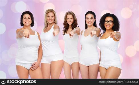 choice, friendship, beauty, body positive and people concept - group of happy different women in white underwear pointing finger on you over blue background