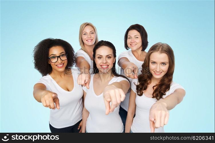 choice, friendship, body positive, gesture and people concept - group of happy different size women in white t-shirts pointing finger on you over blue background