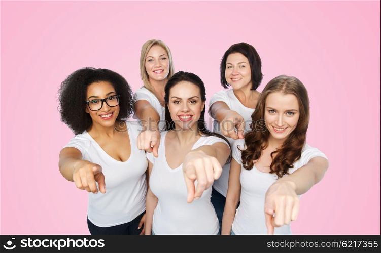 choice, friendship, body positive, gesture and people concept - group of happy different size women in white t-shirts pointing finger on you over pink background