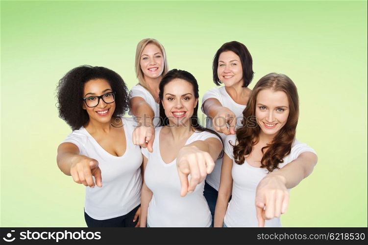 choice, friendship, body positive, gesture and people concept - group of happy different size women in white t-shirts pointing finger on you over green natural background