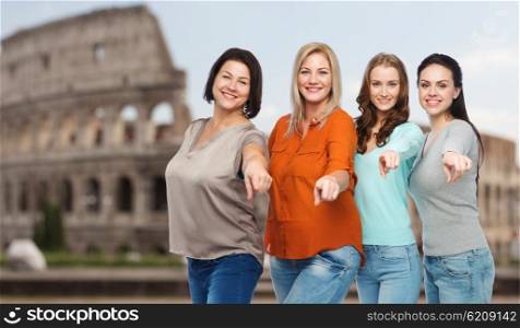 choice, friendship, travel, tourism and people concept - group of happy plus size women in casual clothes pointing finger on you over rome coliseum background