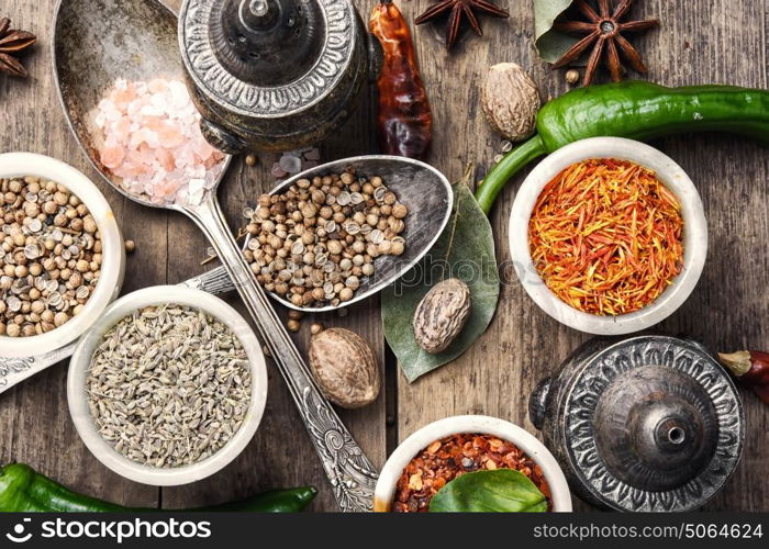 choice Indian spice. set of aromatic Indian spices and condiments on wooden retro background