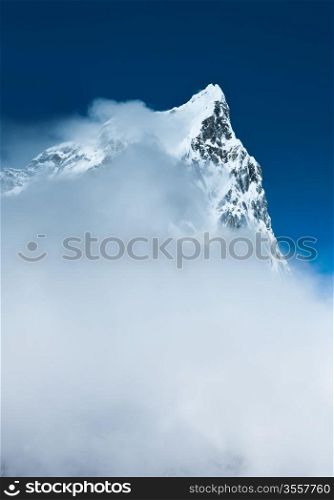 Cholatse (6335m) summit hidden in clouds. Pictured in Nepal