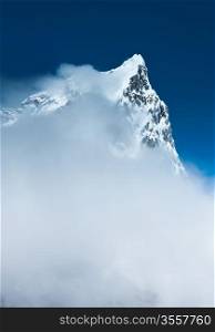 Cholatse (6335m) summit hidden in clouds. Pictured in Nepal