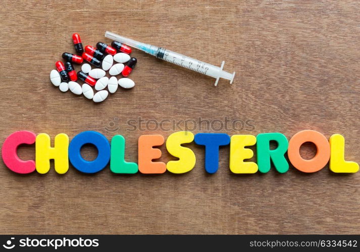 cholesterol colorful word in the wooden background