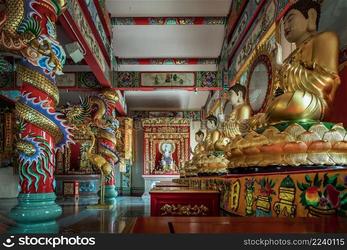 Chonburi, Thailand - 05 Feb 2022 : Architecture of chinese-style temple and Buddha images inside Wihan Thep Sathit Phra Ki Ti Chaloem ( San Chao Na Cha or Naja Shrine). Selective focus.