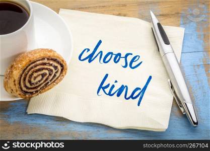 choose kind - inspirational handwriting on a napkin with a cup of coffee