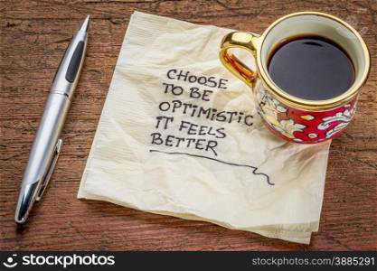 choose to be optimistic, it feels better - motivational handwriting on a napkin with a cup of coffee
