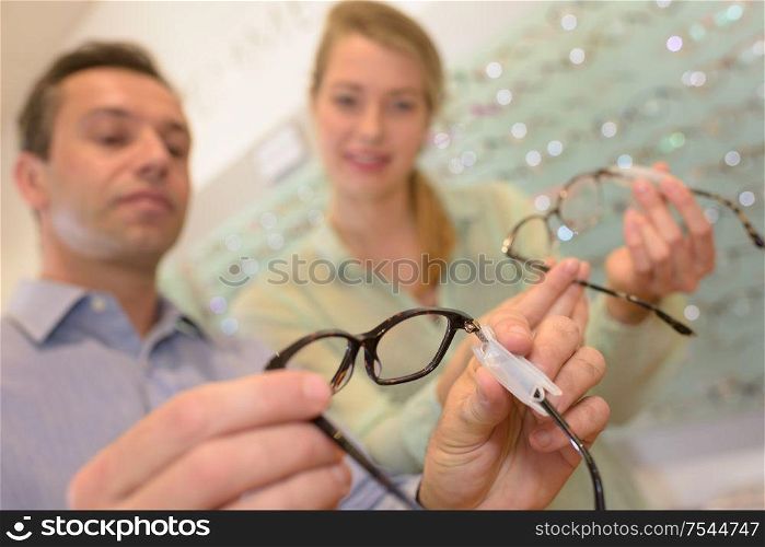 choosing glasses at the optician