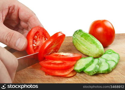 chop tomatoes and cucumbers isolated on white background