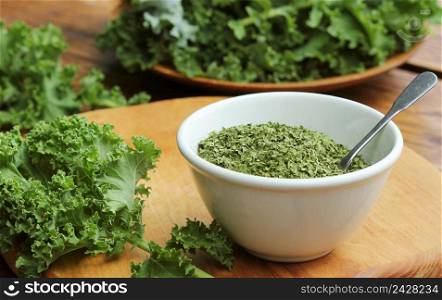 Chopped dry kale leaves on rustic background .. Chopped dry kale leaves on rustic background