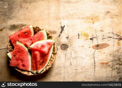 Chopped pieces of watermelon . On wooden background.. Chopped pieces of watermelon .