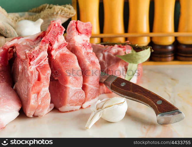 Chopped pork on a marble countertop in the kitchen