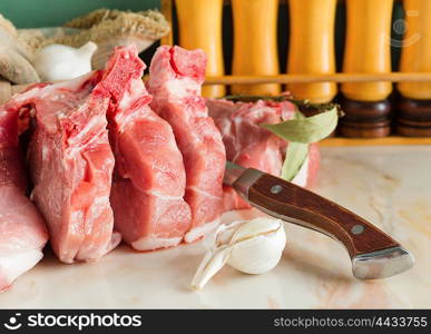 Chopped pork on a marble countertop in the kitchen