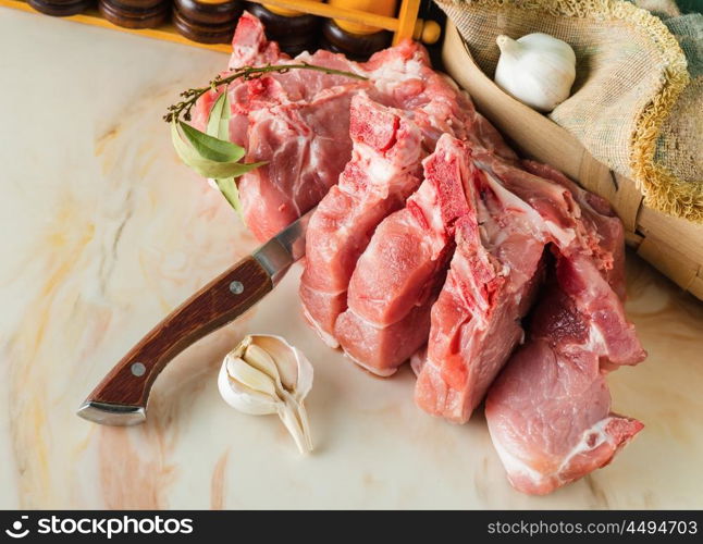 Chopped pork on a marble countertop in the kitchen